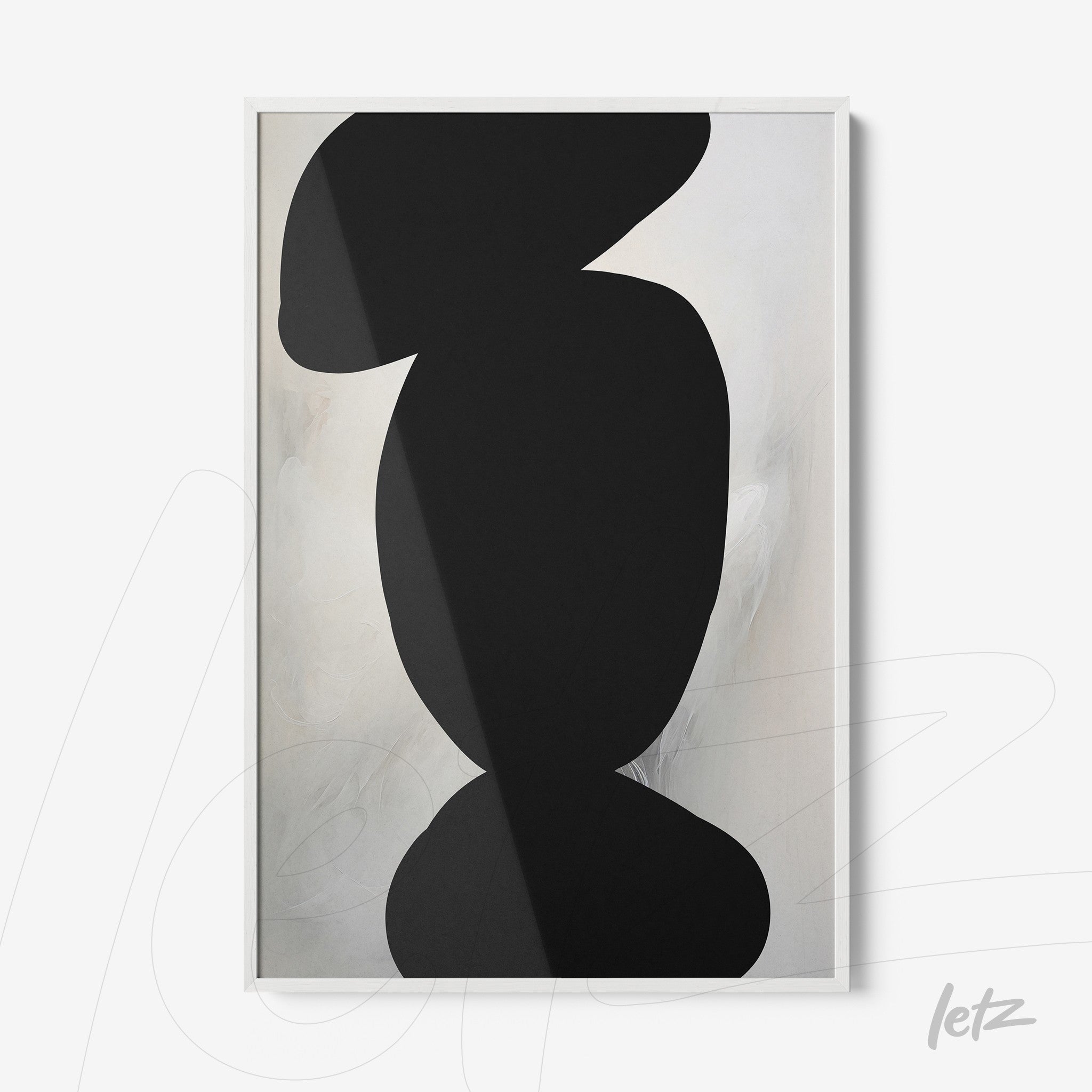 abstract wall art featuring black shapes on a light background with a sleek white frame