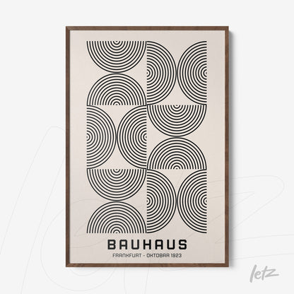 poster with black and white geometric pattern framed in dark wood