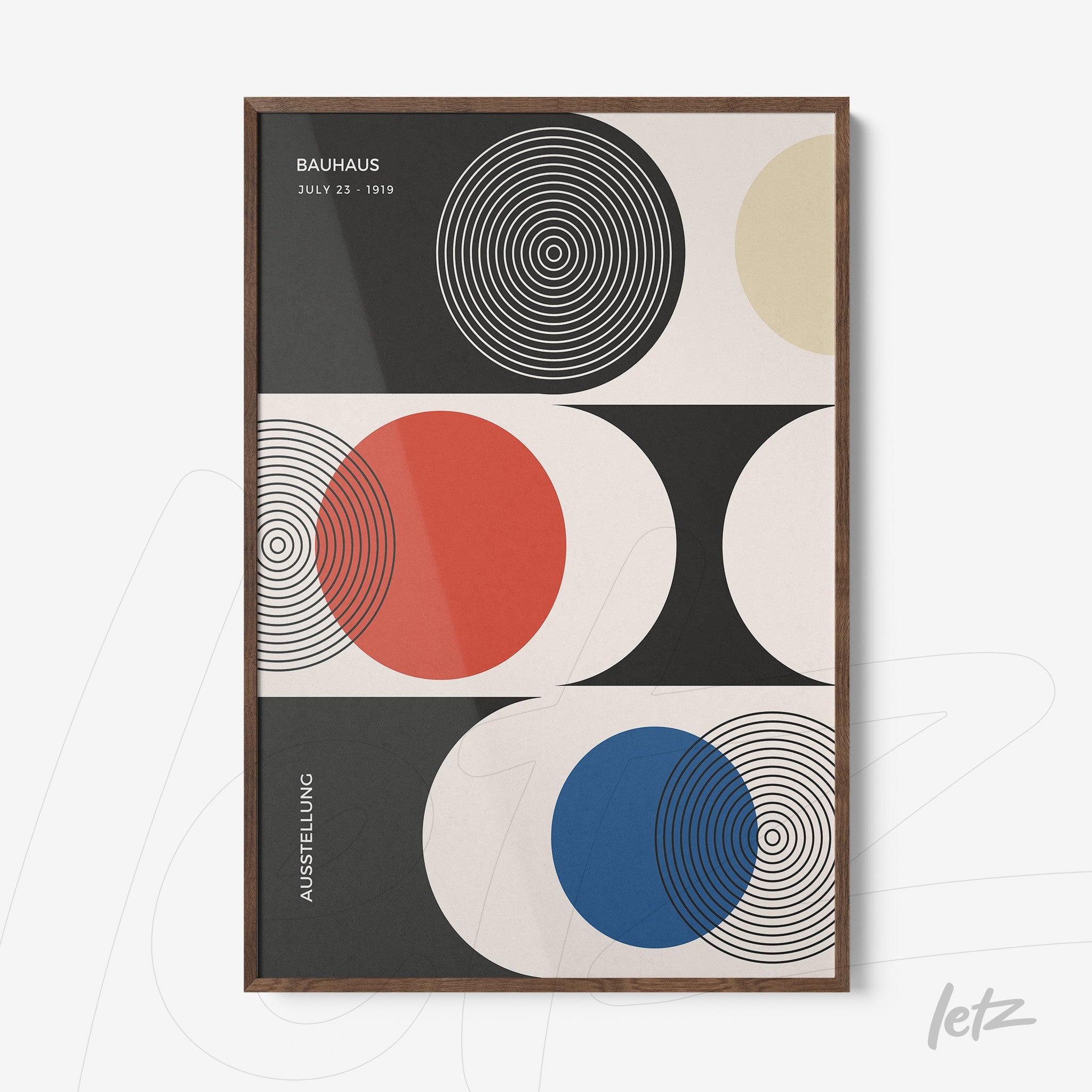 canvas wall art with abstract design of concentric circles in red, blue, and black, dark wood frame