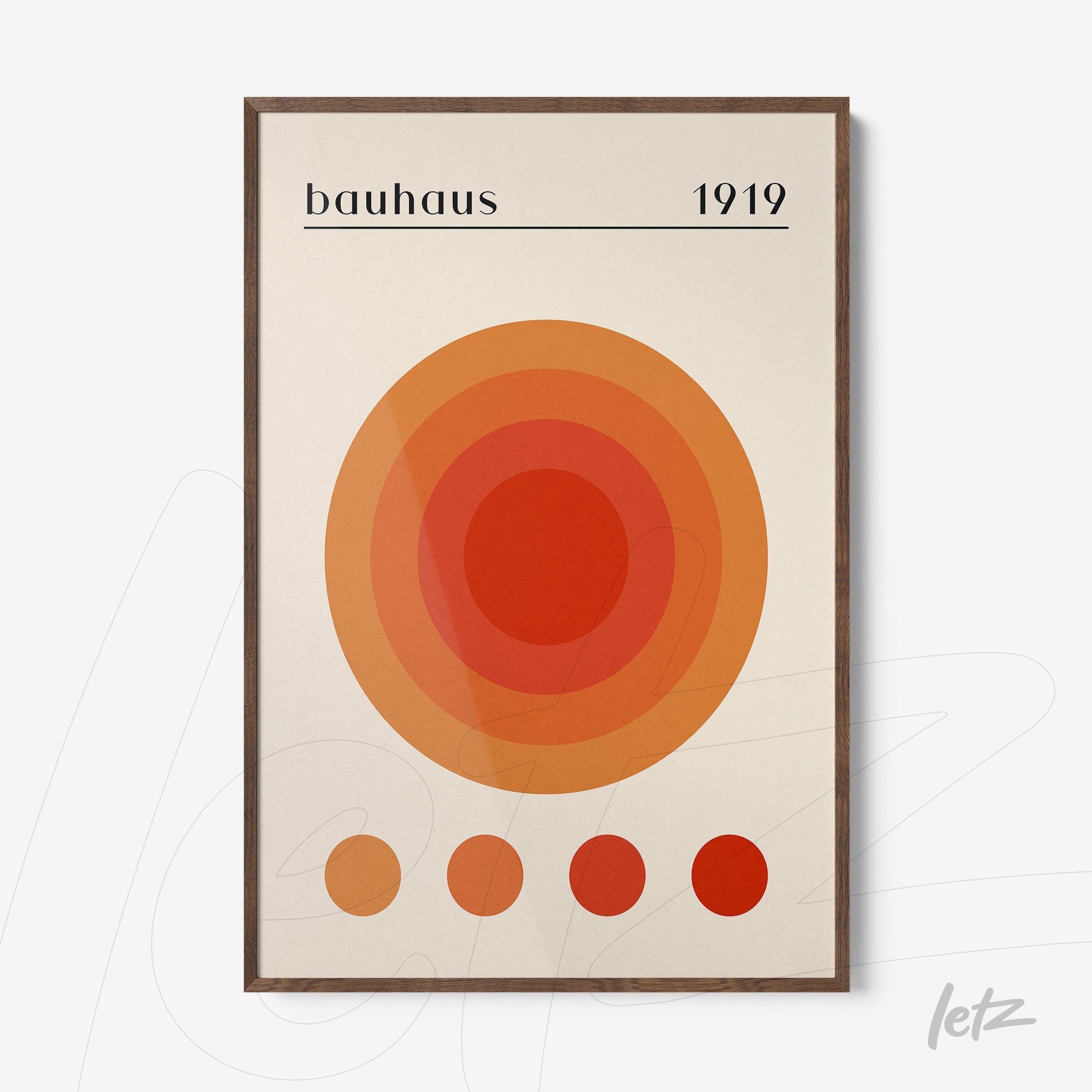 poster print featuring geometric bauhaus design with concentric circles in orange and red hues, in a dark wooden frame