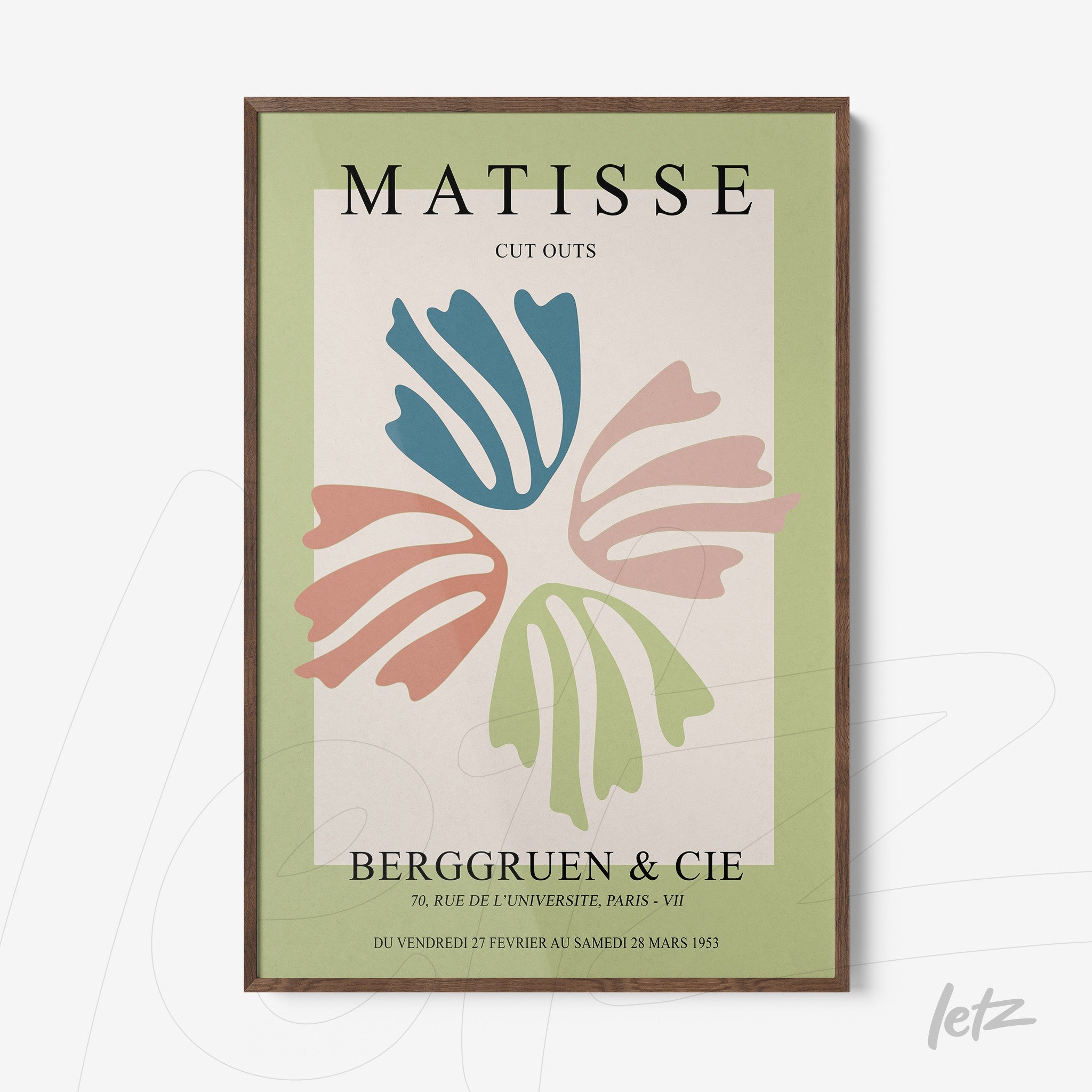 framed wall art featuring colorful leaf cutouts on a light background