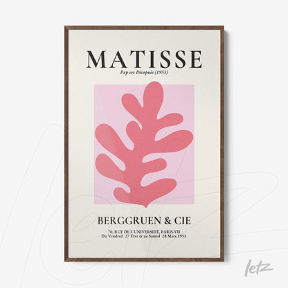 framed wall art featuring a pink shape on light background by Matisse with dark wooden frame