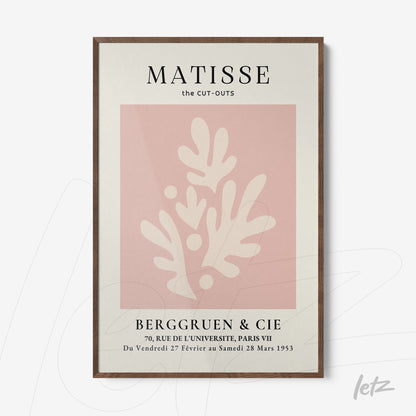 framed modern art print featuring organic shapes on pink background with dark wood frame