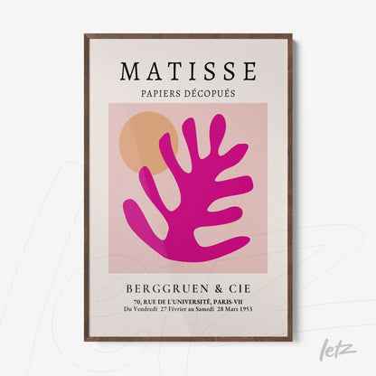 modern wall art featuring organic shapes in pink and orange tones, framed in dark wood