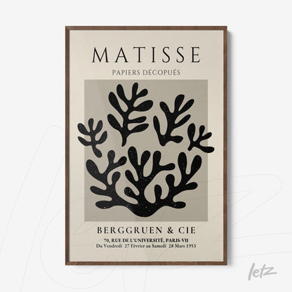 decorative wall art featuring cut-out style leaves design in dark wood frame