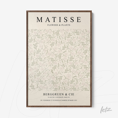 framed wall art featuring a light background with pastel-colored flowers and plants with a light brown frame