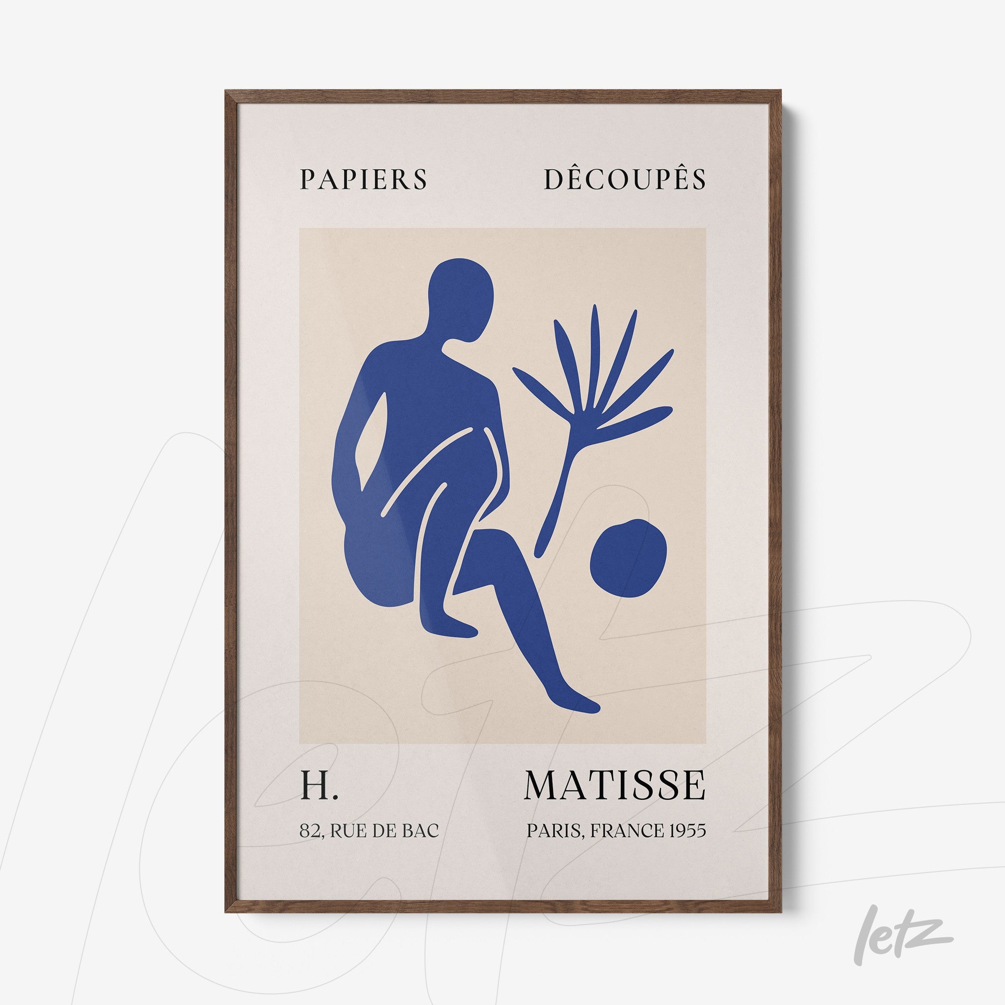 framed artwork featuring contemporary blue silhouette of a seated figure next to a plant on light background with dark wooden frame