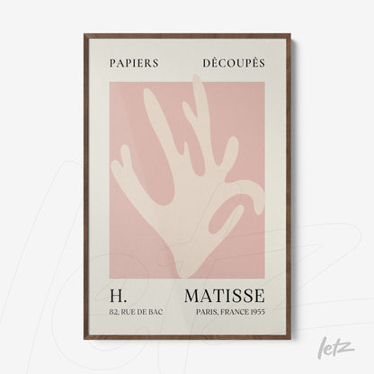 framed art print featuring abstract organic shapes in pink and cream tones with dark wood frame