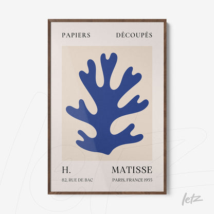 abstract wall art featuring a blue coral shape with a light wood frame