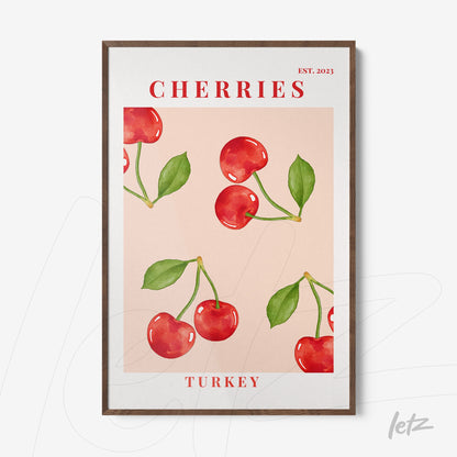 framed art featuring cherries on a light pink background with a dark wood frame