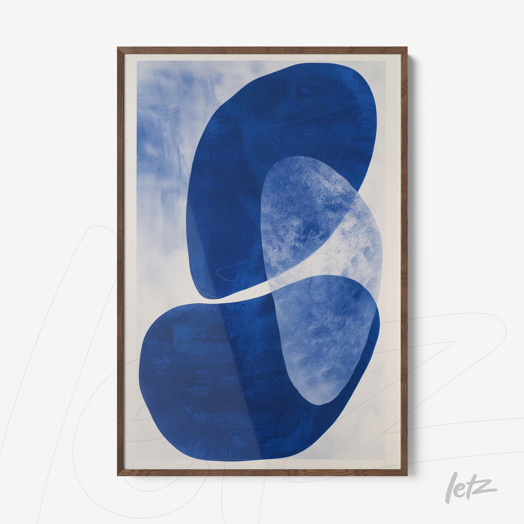 abstract wall art in shades of blue on a light background with dark wood frame