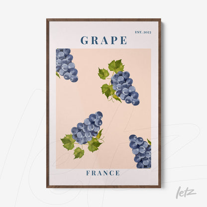 framed art featuring grapes on a pink background with dark wood frame