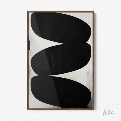 framed abstract wall art in black and white with light wood frame