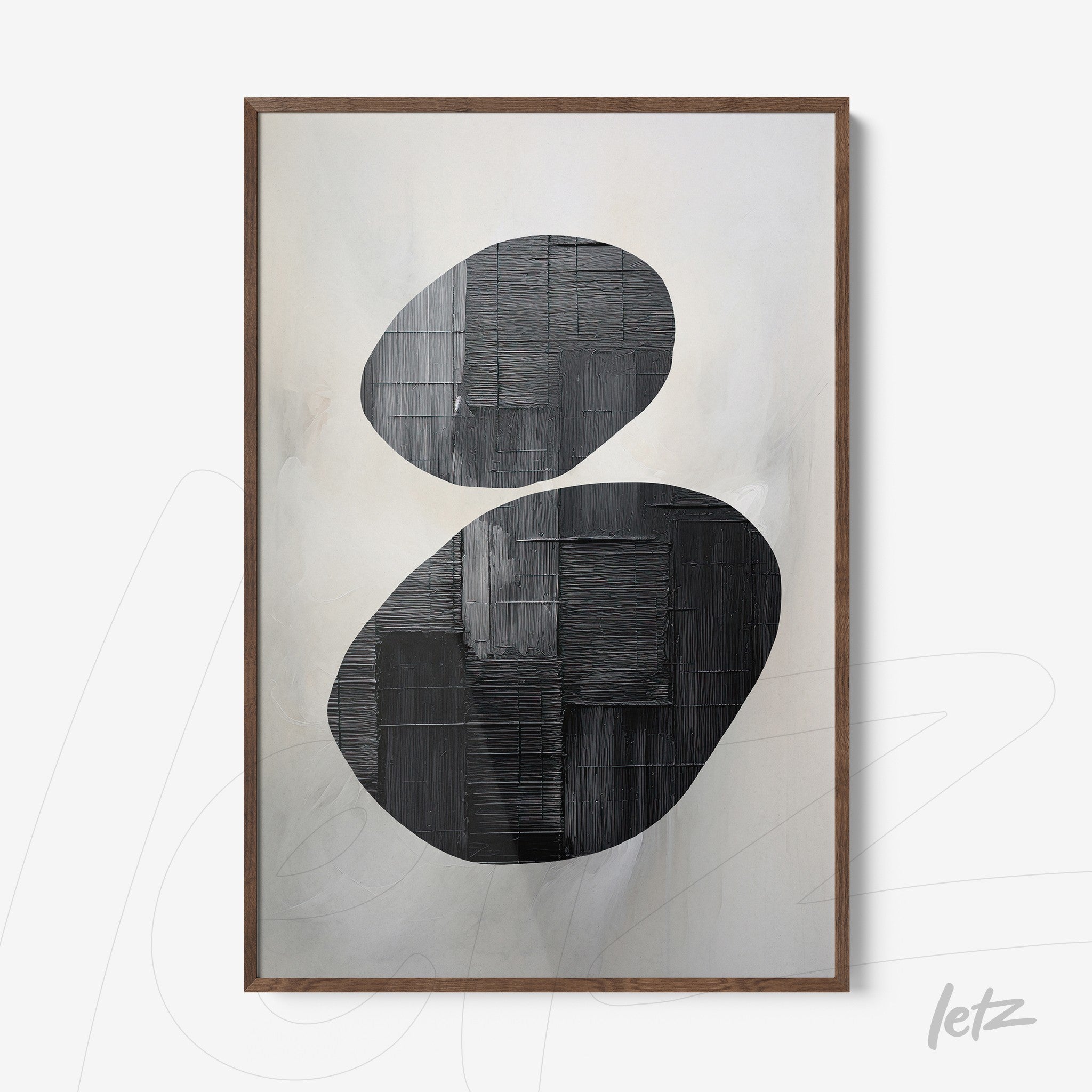 abstract wall art in black and white featuring bold shapes in dark wooden frame