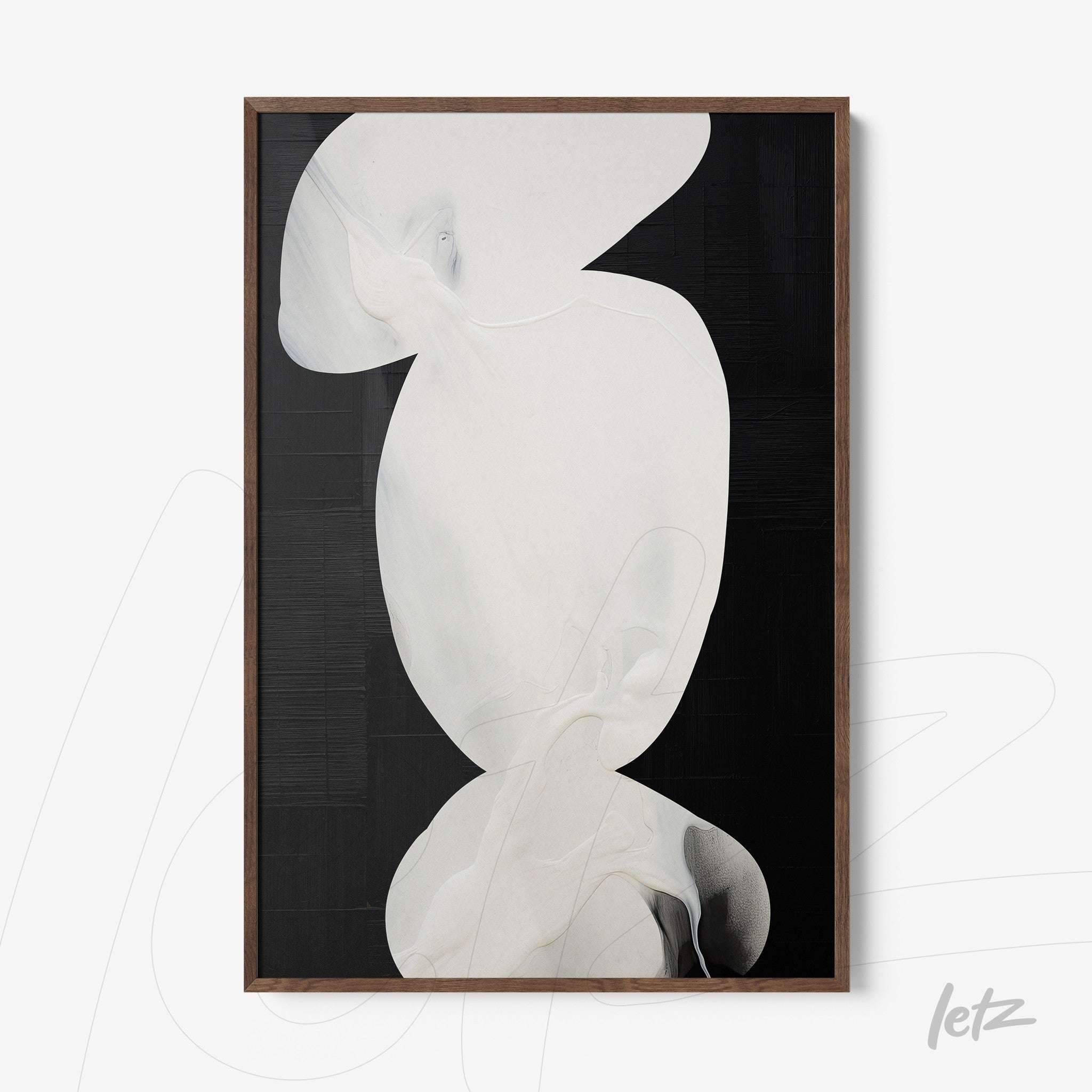 framed abstract art with white and black tones featuring a natural wood frame