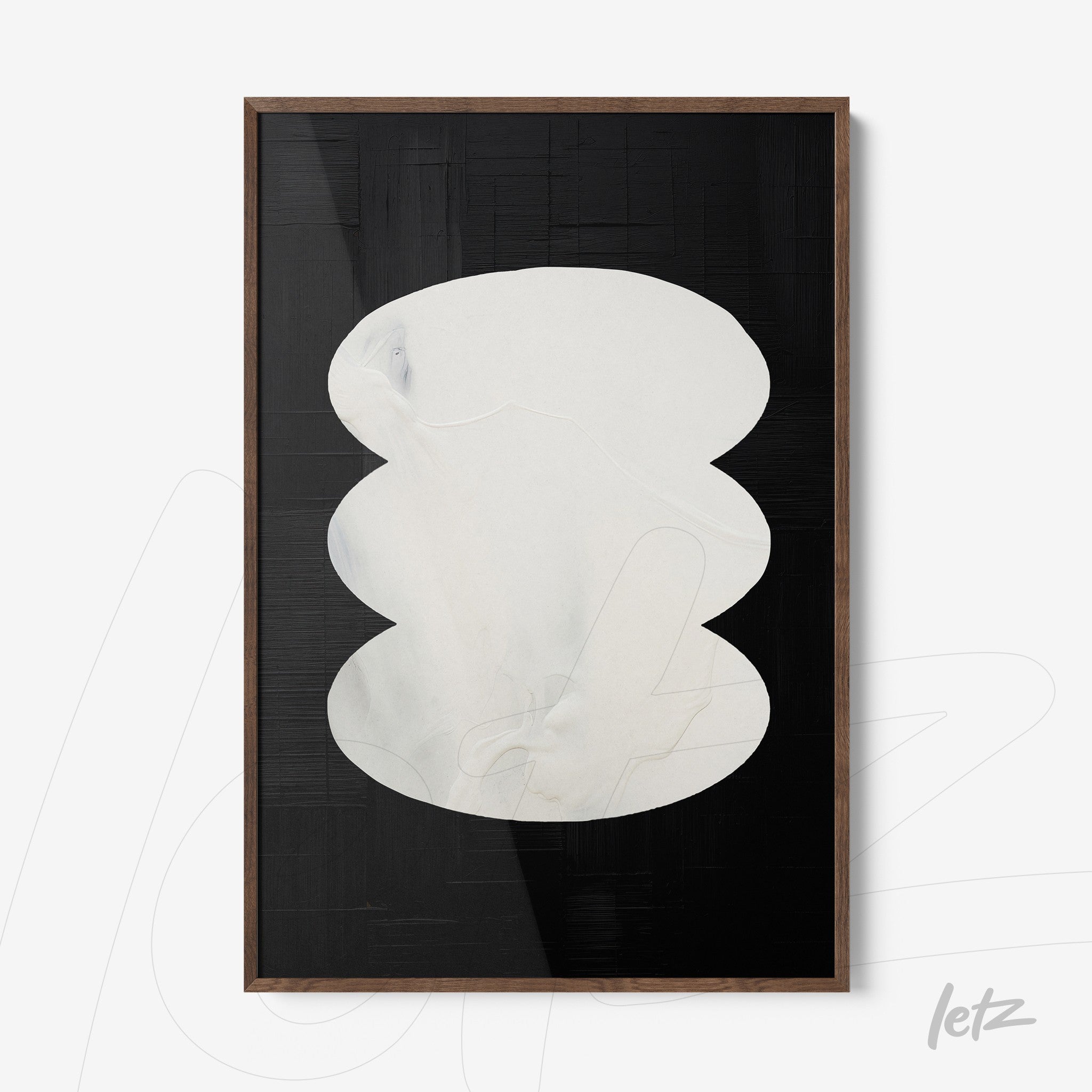 framed abstract artwork in black and white featuring organic shapes on dark background