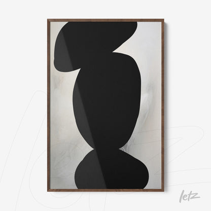 framed art with abstract black shapes on light background in light wood frame