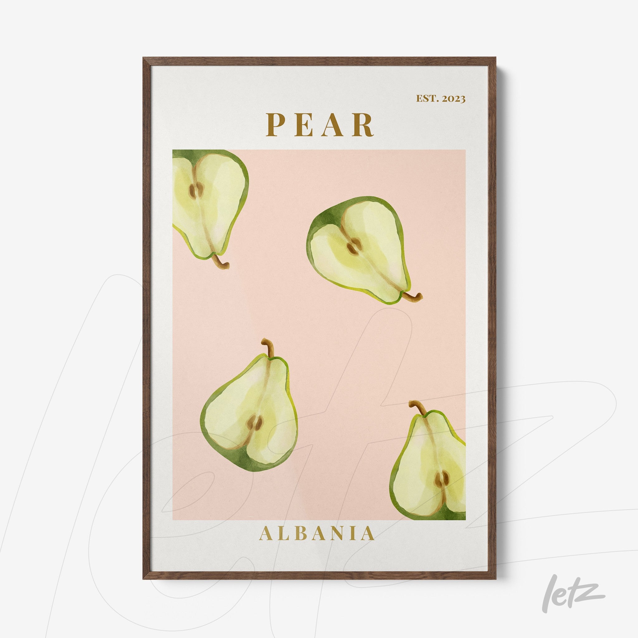framed wall art featuring pears on a pink background with gold text