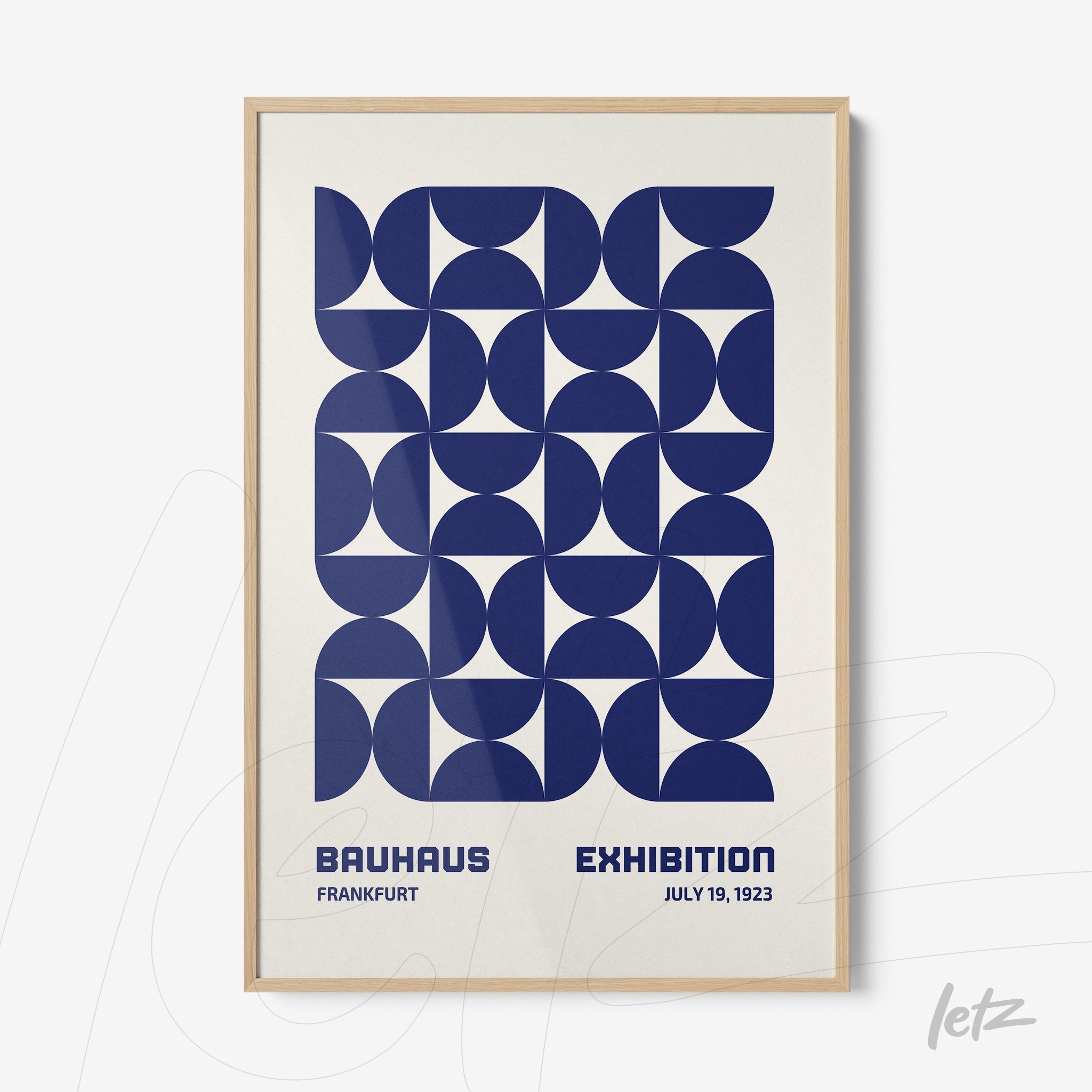 poster featuring blue geometric art in a light wood frame