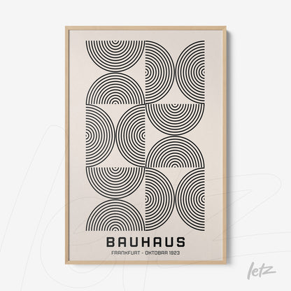 poster with geometric black and white bauhaus style art, framed with light wood