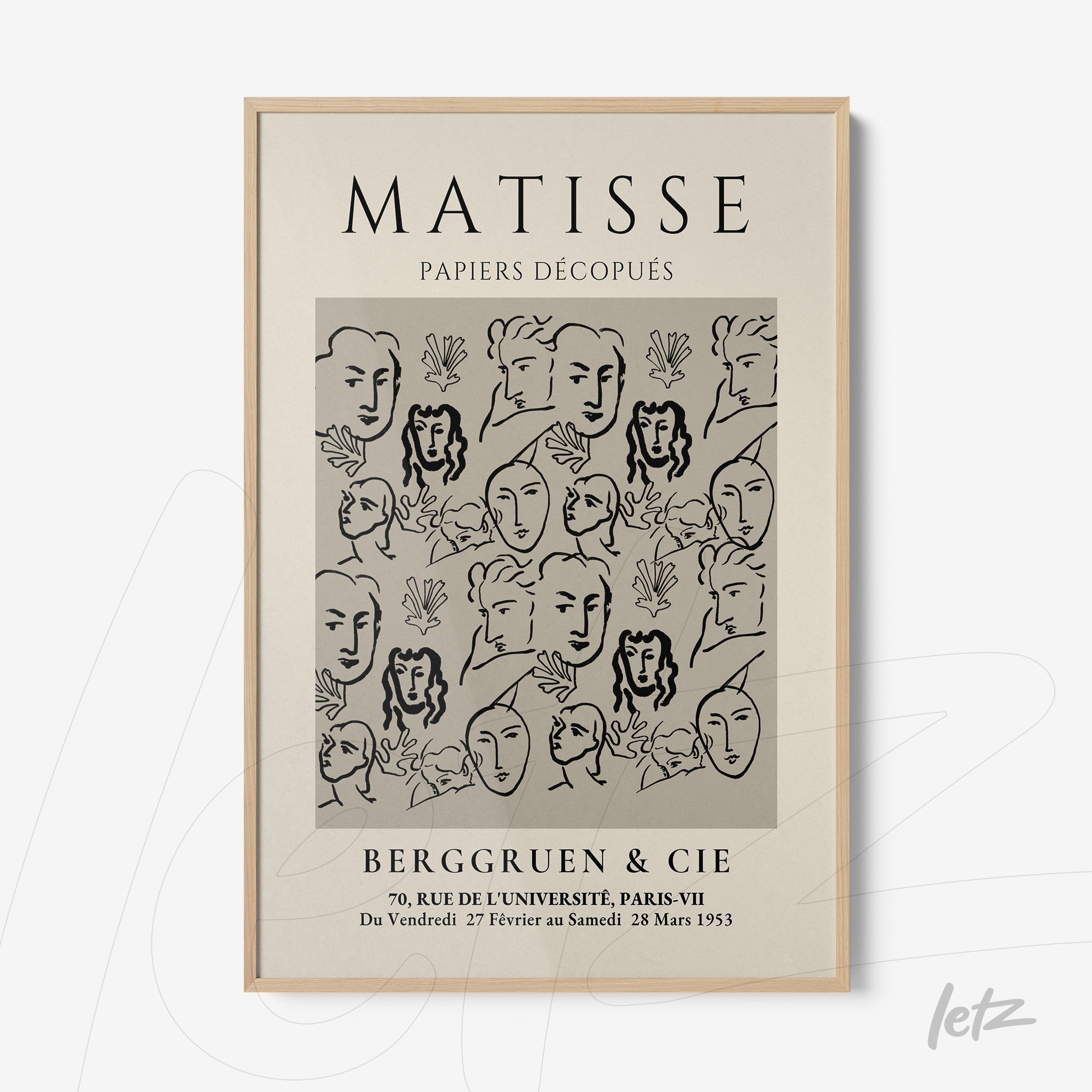 framed wall art featuring abstract design with stylized faces in black lines against gray background, light wood frame