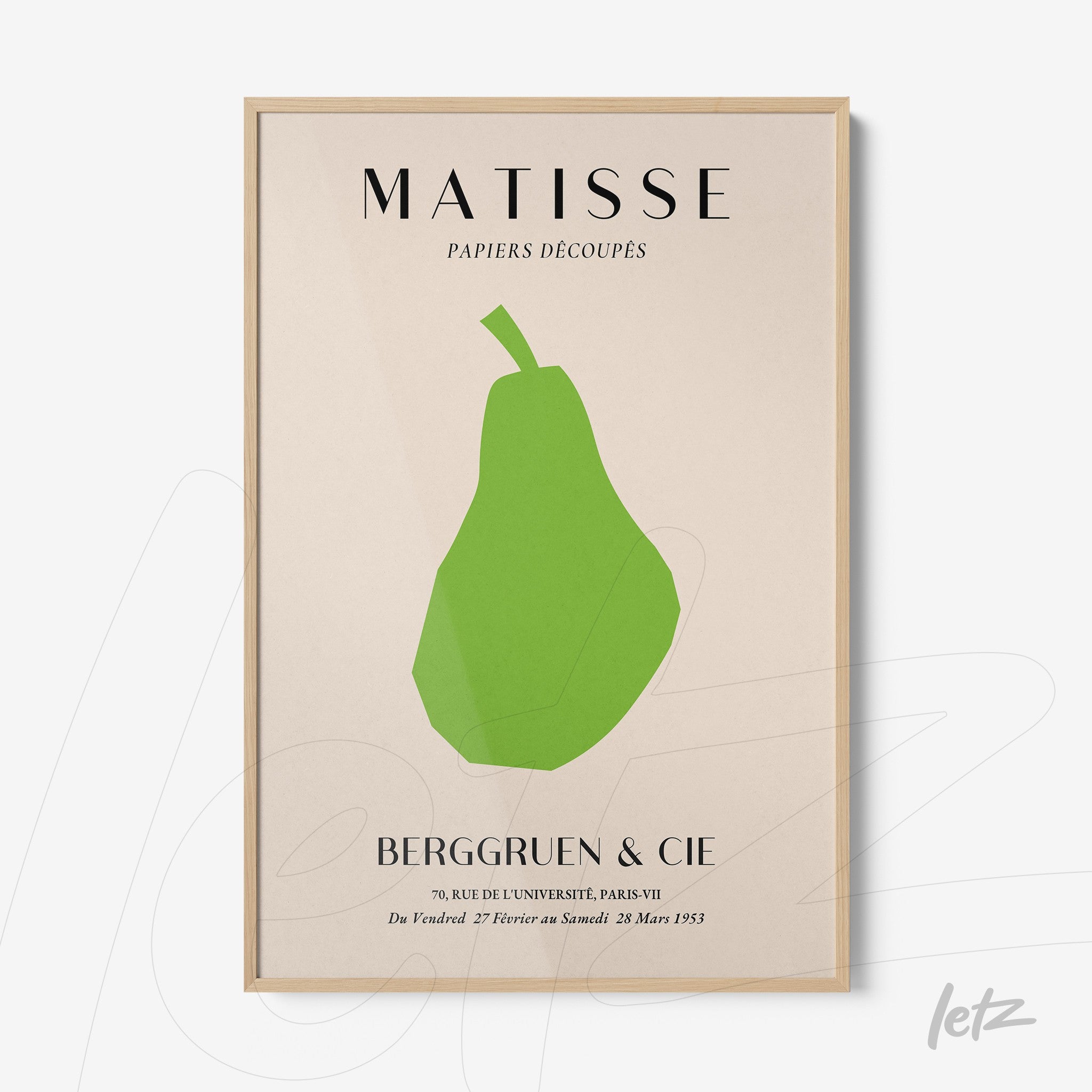 framed wall art featuring a minimalist green pear on light background with light wood frame