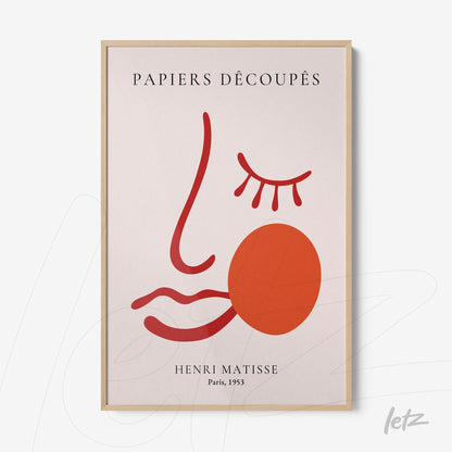 framed wall art featuring a minimalist abstract face design with light wood frame