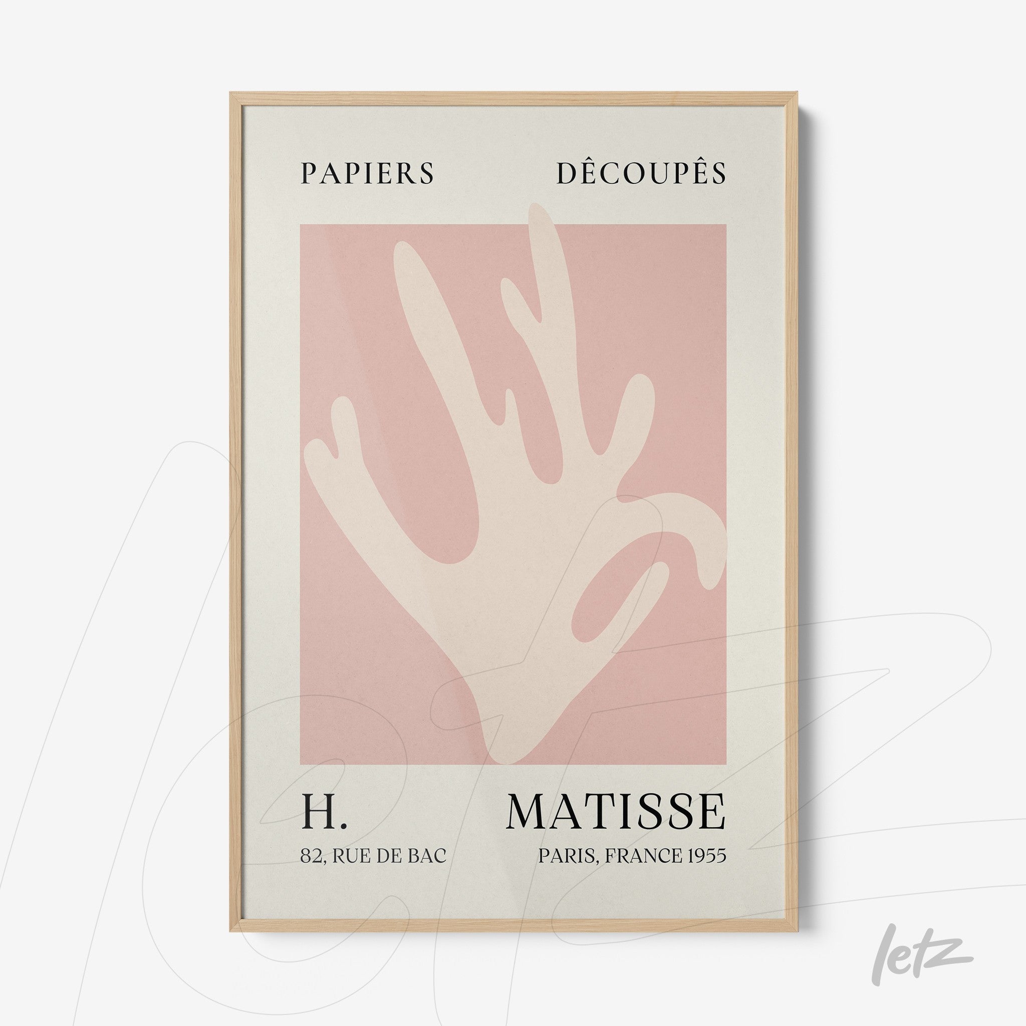 framed art inspired by henri matisse featuring an abstract silhouette in pink tones on cream background with light wood frame