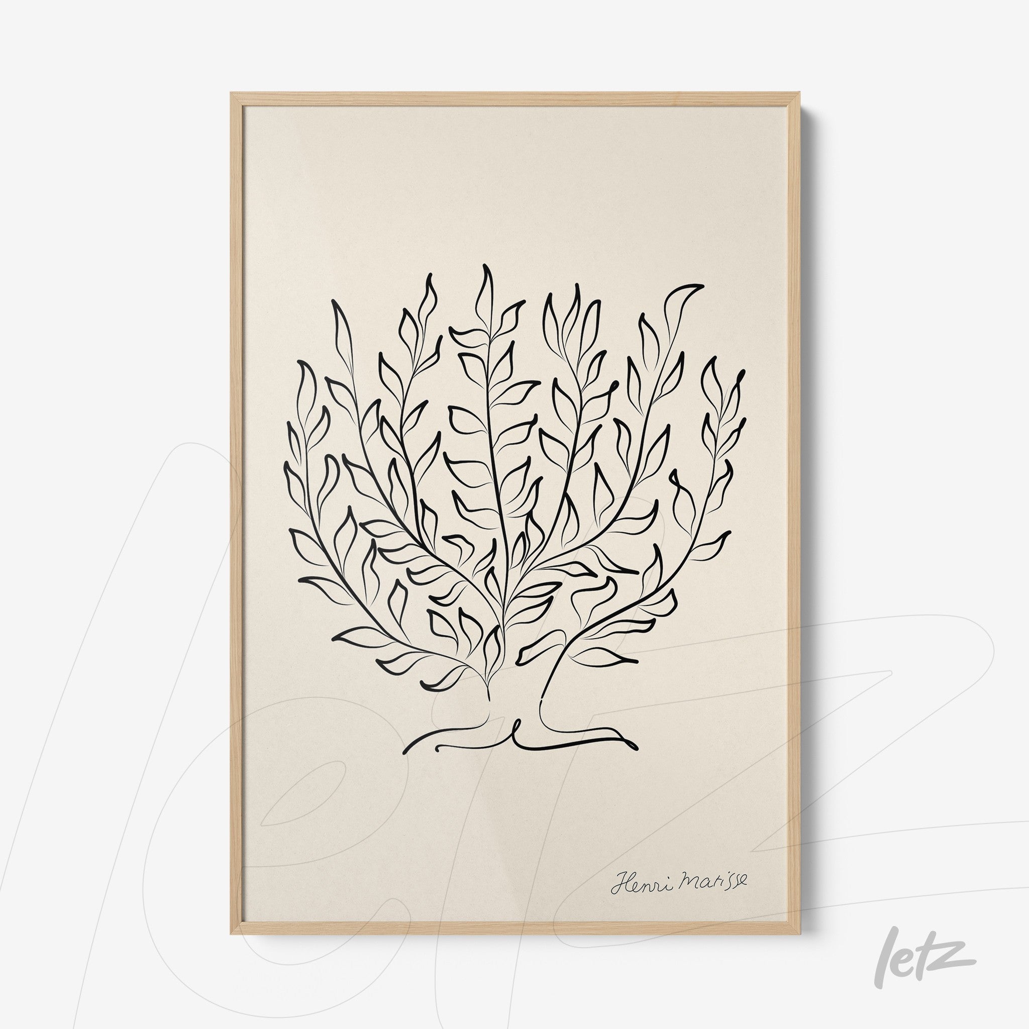 framed wall art featuring minimalist leaf design with light wood frame