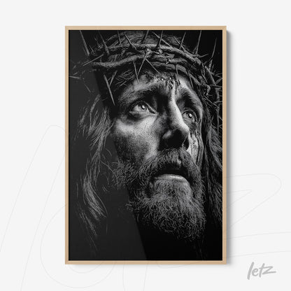 framed black and white portrait of Jesus Christ wearing a crown of thorns with light wood frame