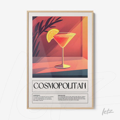 vintage style framed art of cosmopolitan cocktail with light wood frame and leafy details