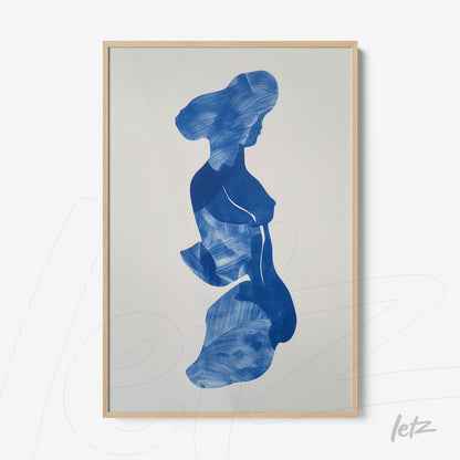 framed wall art featuring an abstract blue silhouette of a woman in light wood frame