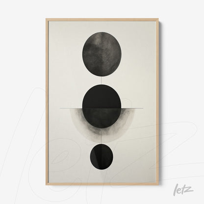 abstract wall art in black and white featuring circular shapes in light wood frame