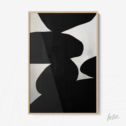 framed abstract wall art in black and white with light wood frame