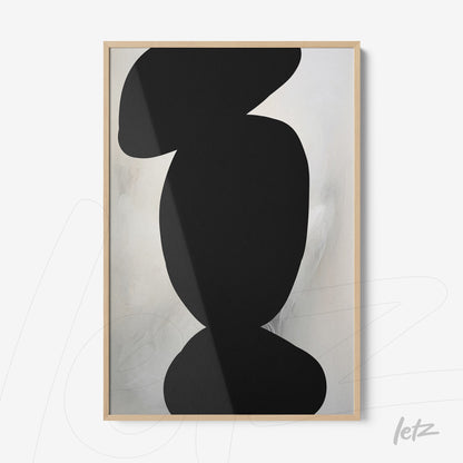 framed abstract art in black on light background with natural wood frame