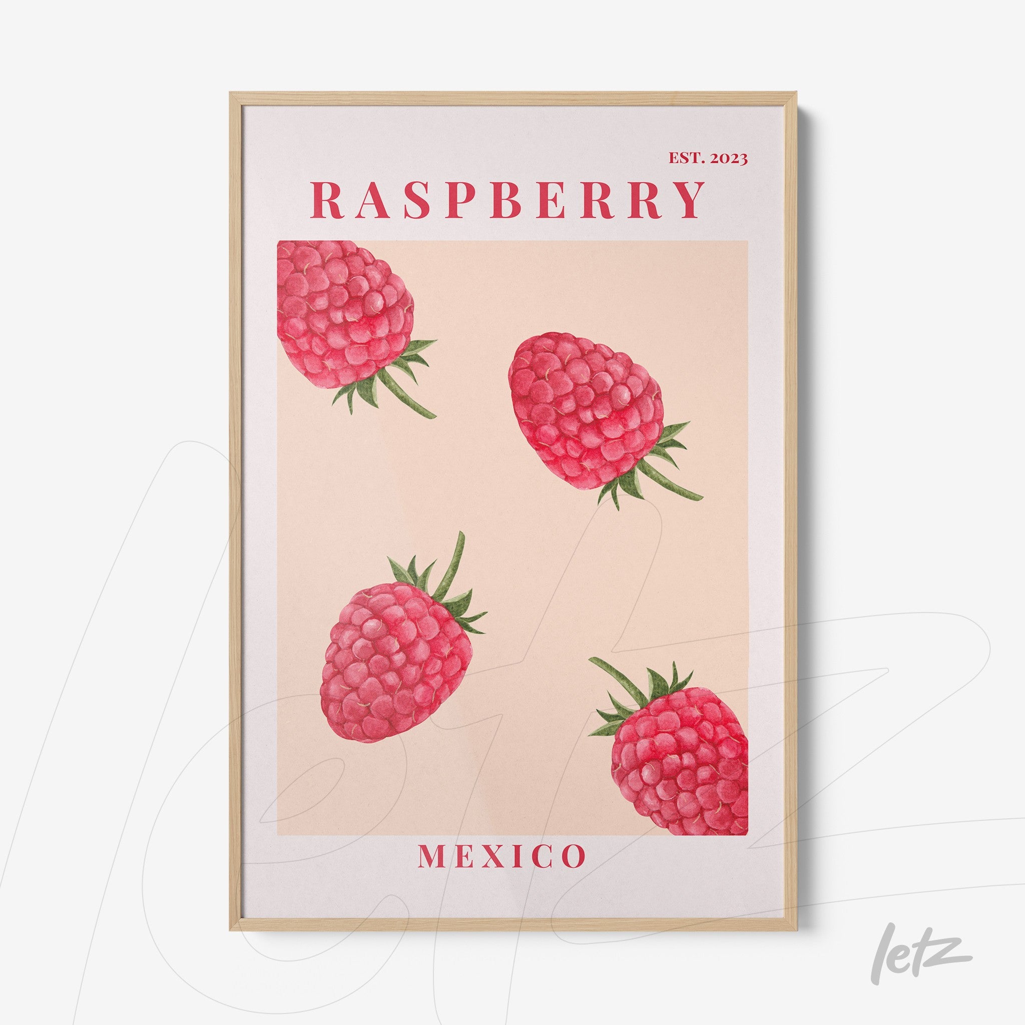 framed wall art featuring raspberries on a light background with a light wood frame