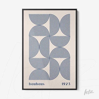 poster with blue geometric pattern and 'bauhaus 1923' text framed in thin black frame
