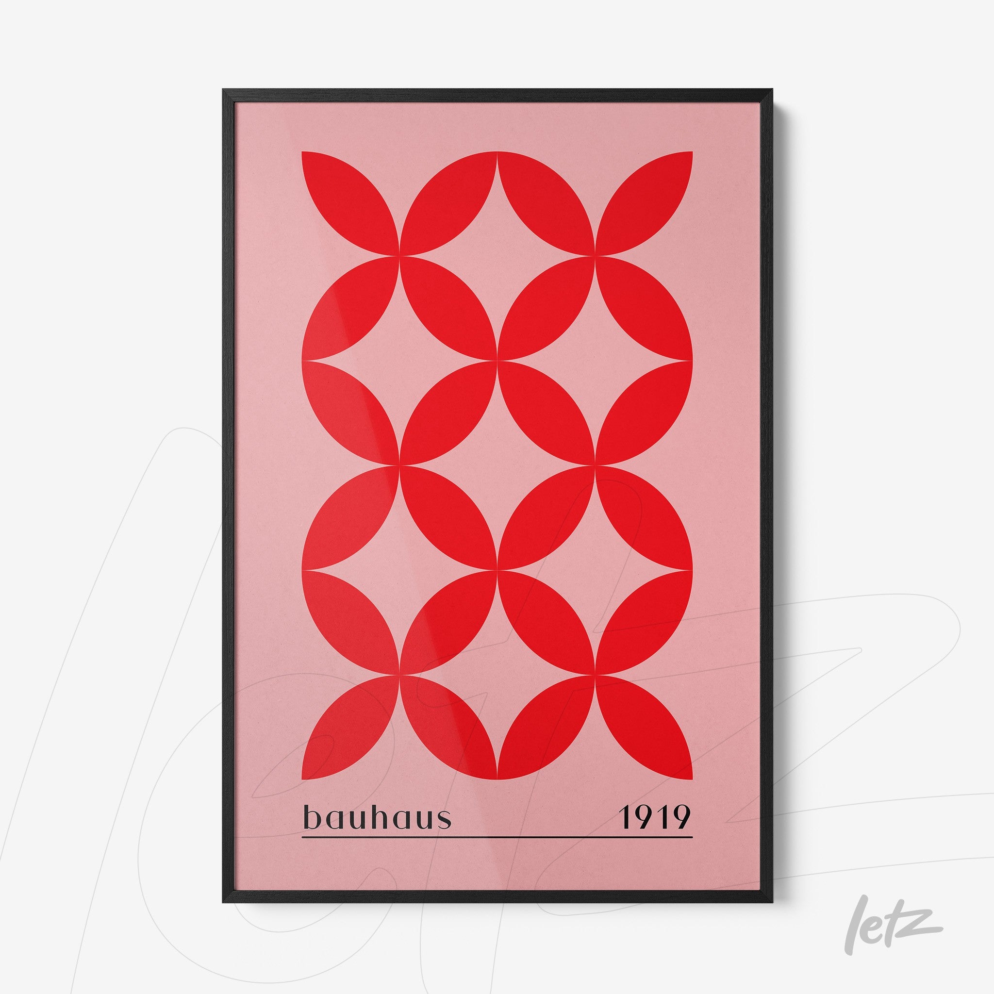 poster with geometric design in red and pink inspired by Bauhaus style, framed with black border