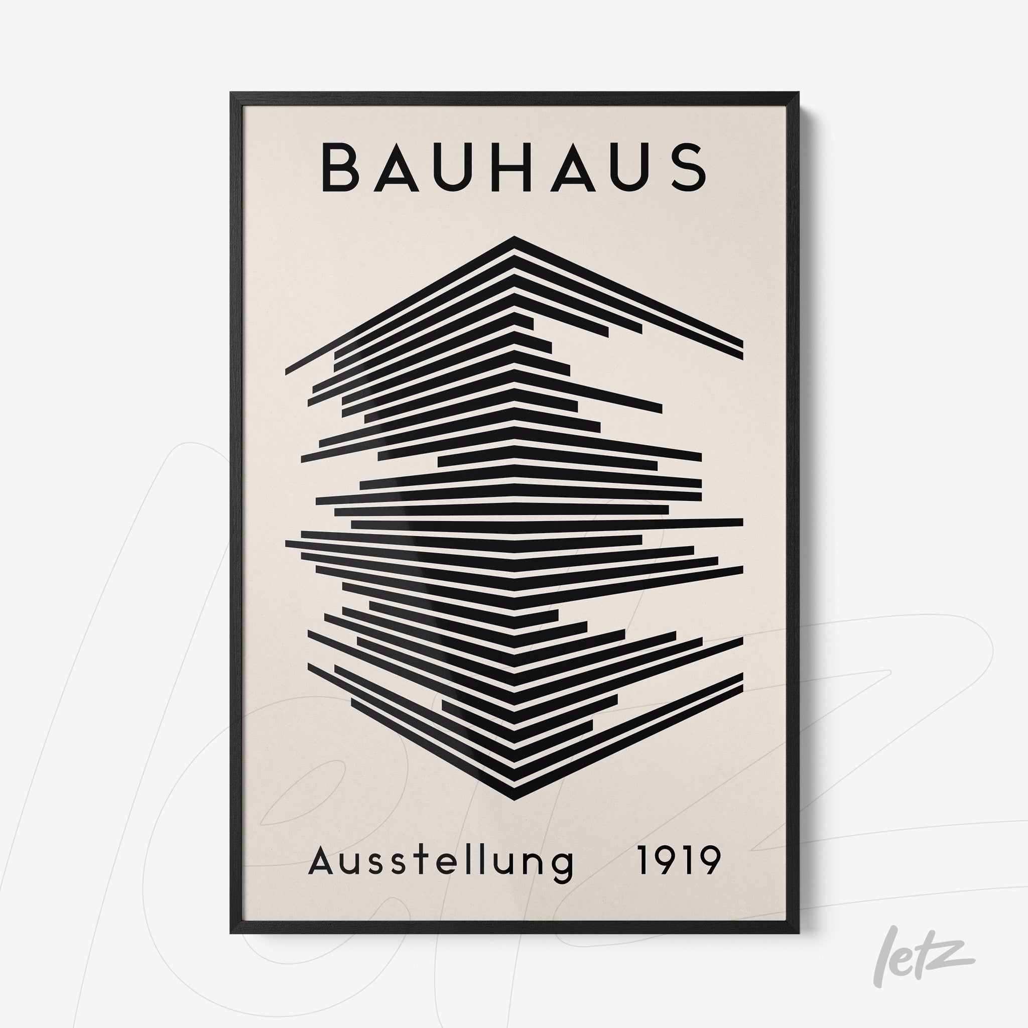 Bauhaus style poster print with black geometric shapes and minimalist text, framed in black