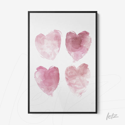 framed wall art featuring four pink watercolor hearts with a black frame