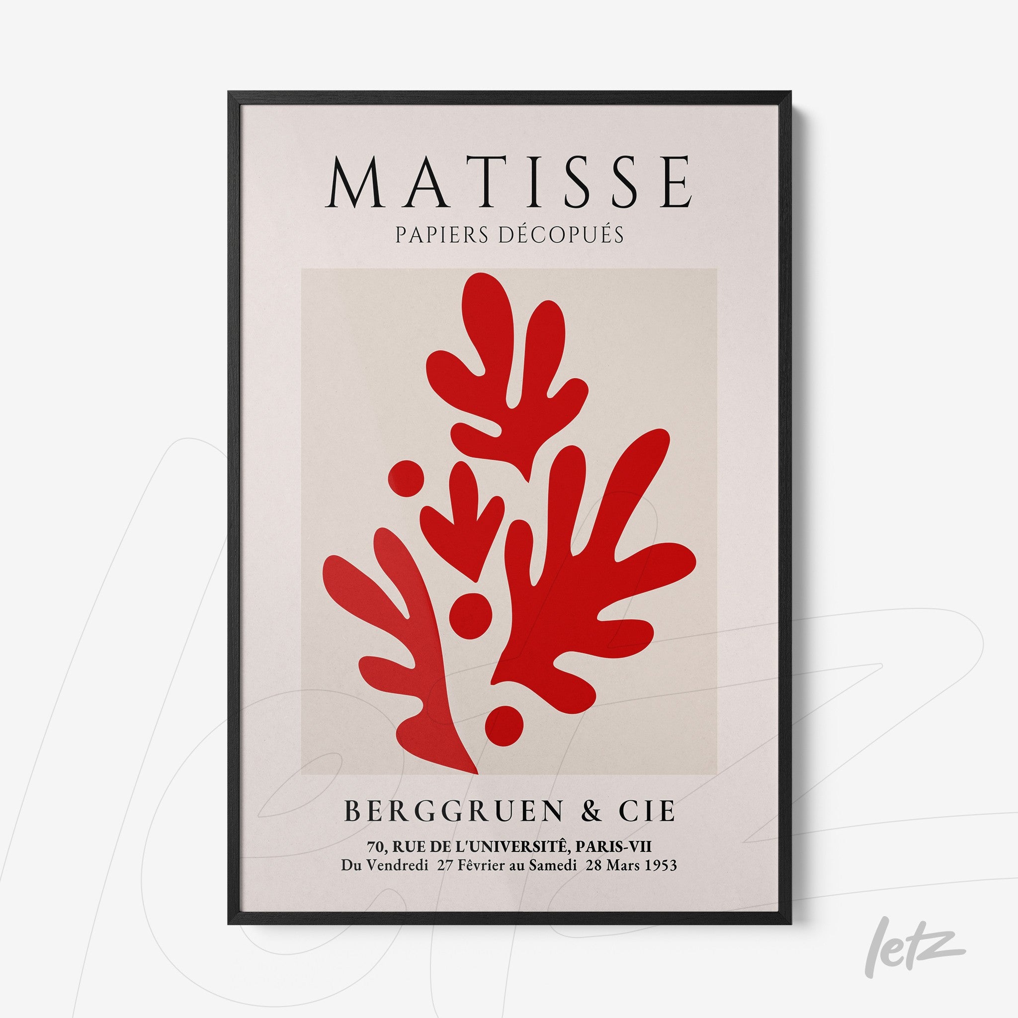 framed modern art print featuring cut paper design in red on light background with thin black frame