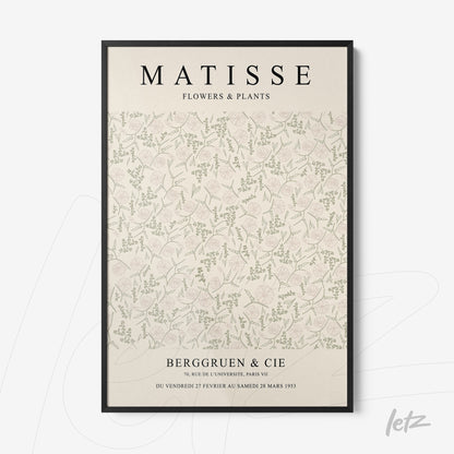 framed wall art featuring a vintage style illustration of flowers and plants with a black frame and light background