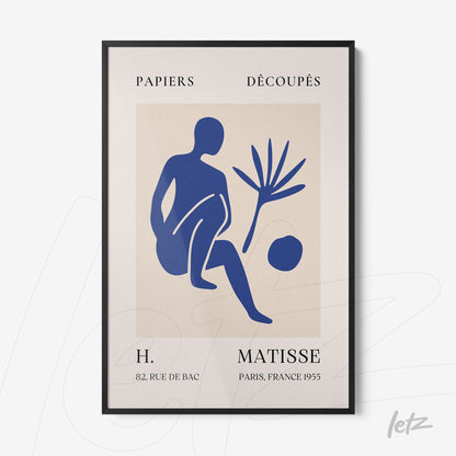 framed abstract art in blue depicting a human figure and a plant