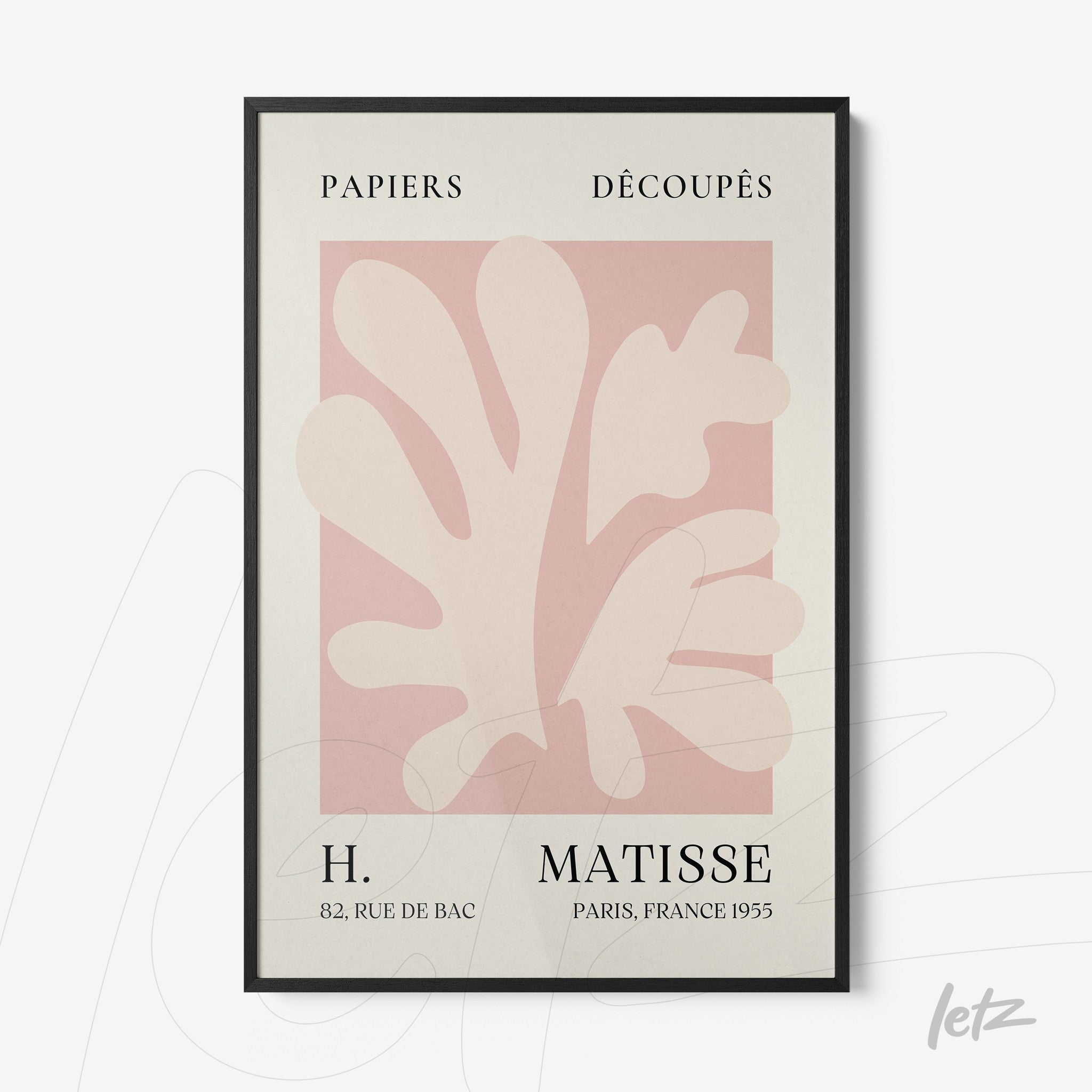 modern art framed print of paper cutouts featuring organic shapes in shades of pink on light background with black frame