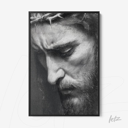 framed black and white portrait of a male figure with a thoughtful expression and crown of thorns