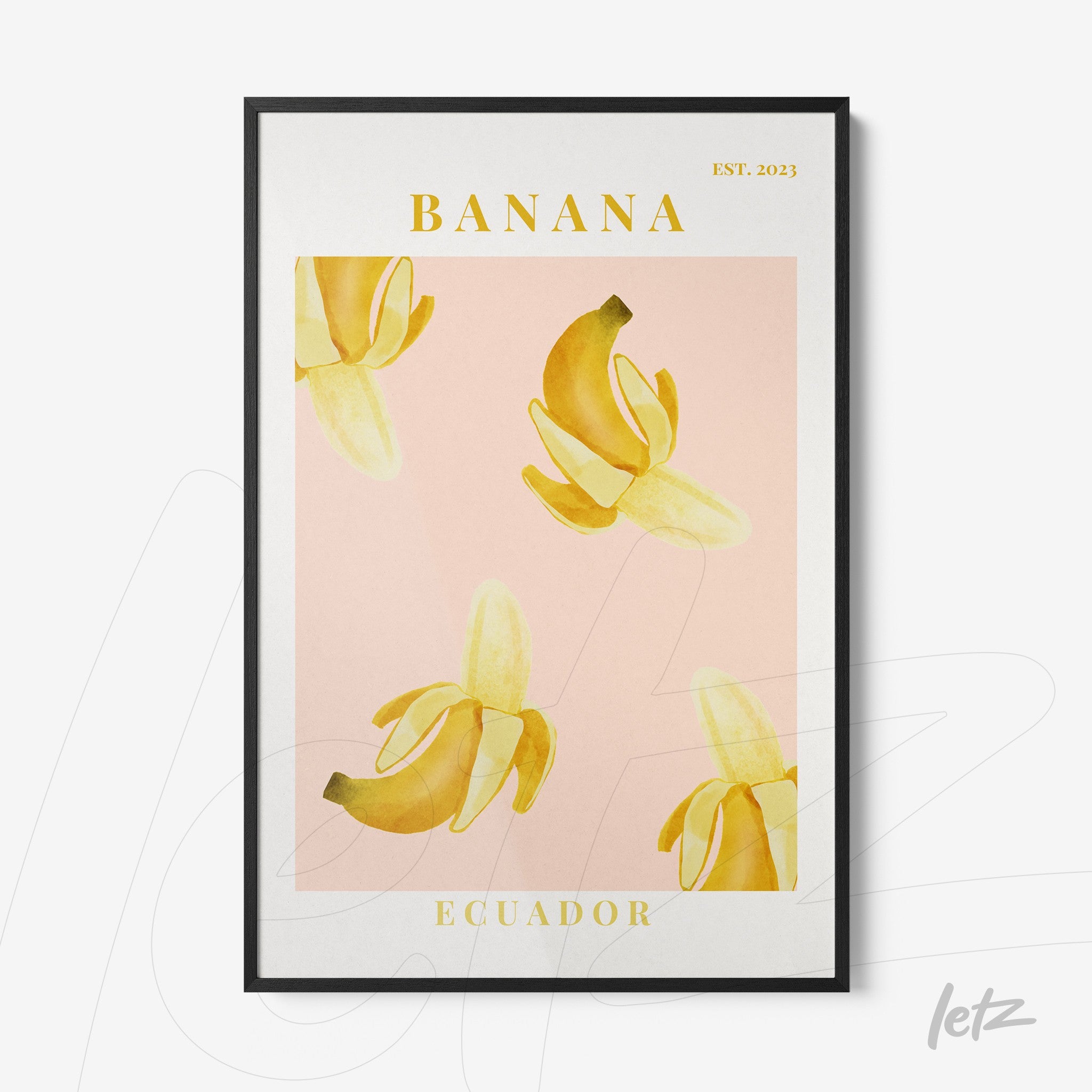 framed art print featuring bananas on a pink background with black frame