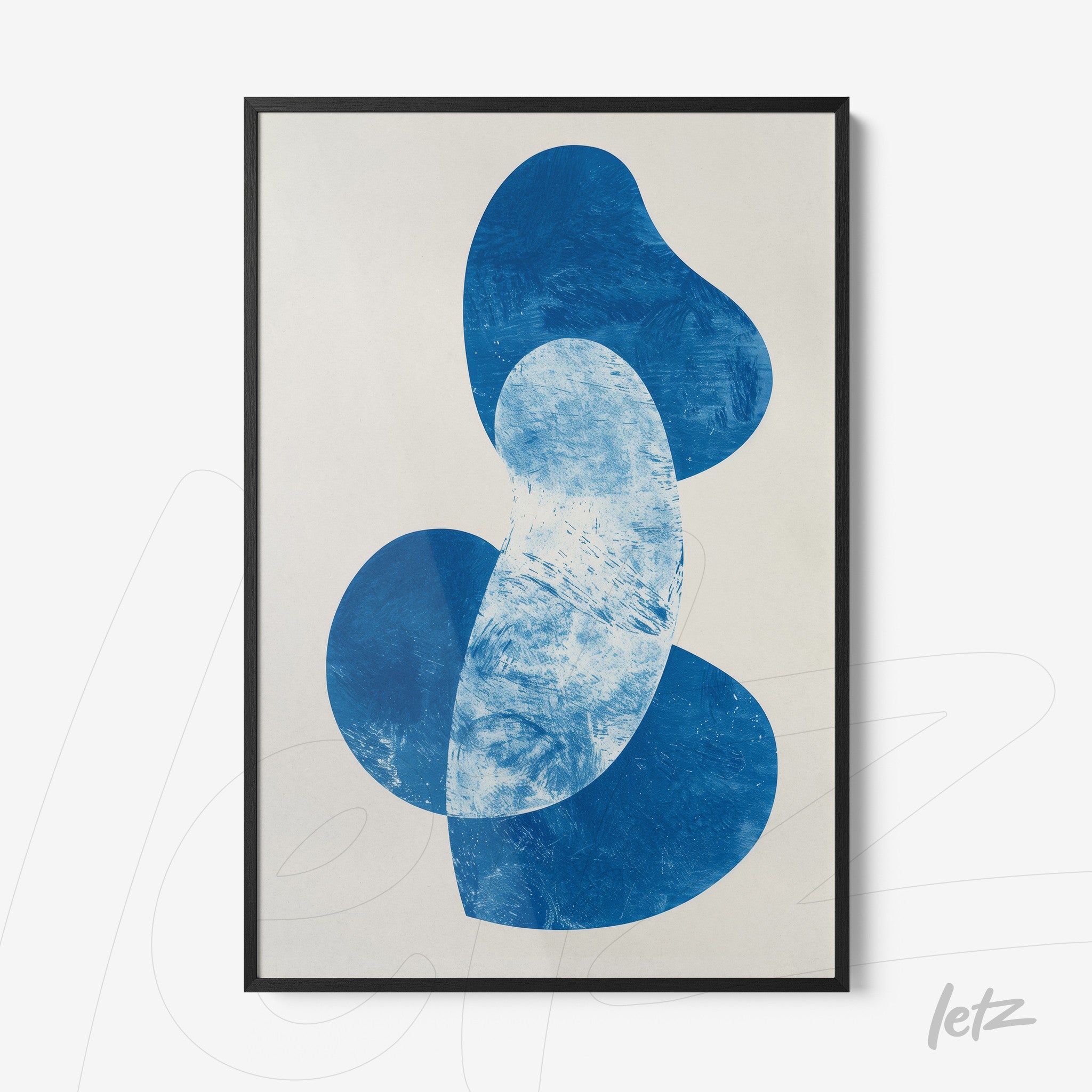 framed abstract artwork in blue shapes on light background