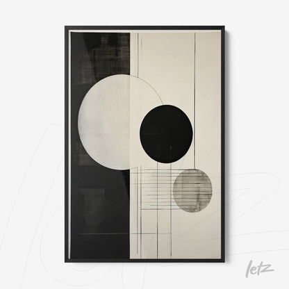 framed abstract wall art in black and white featuring circles and lines on a light background