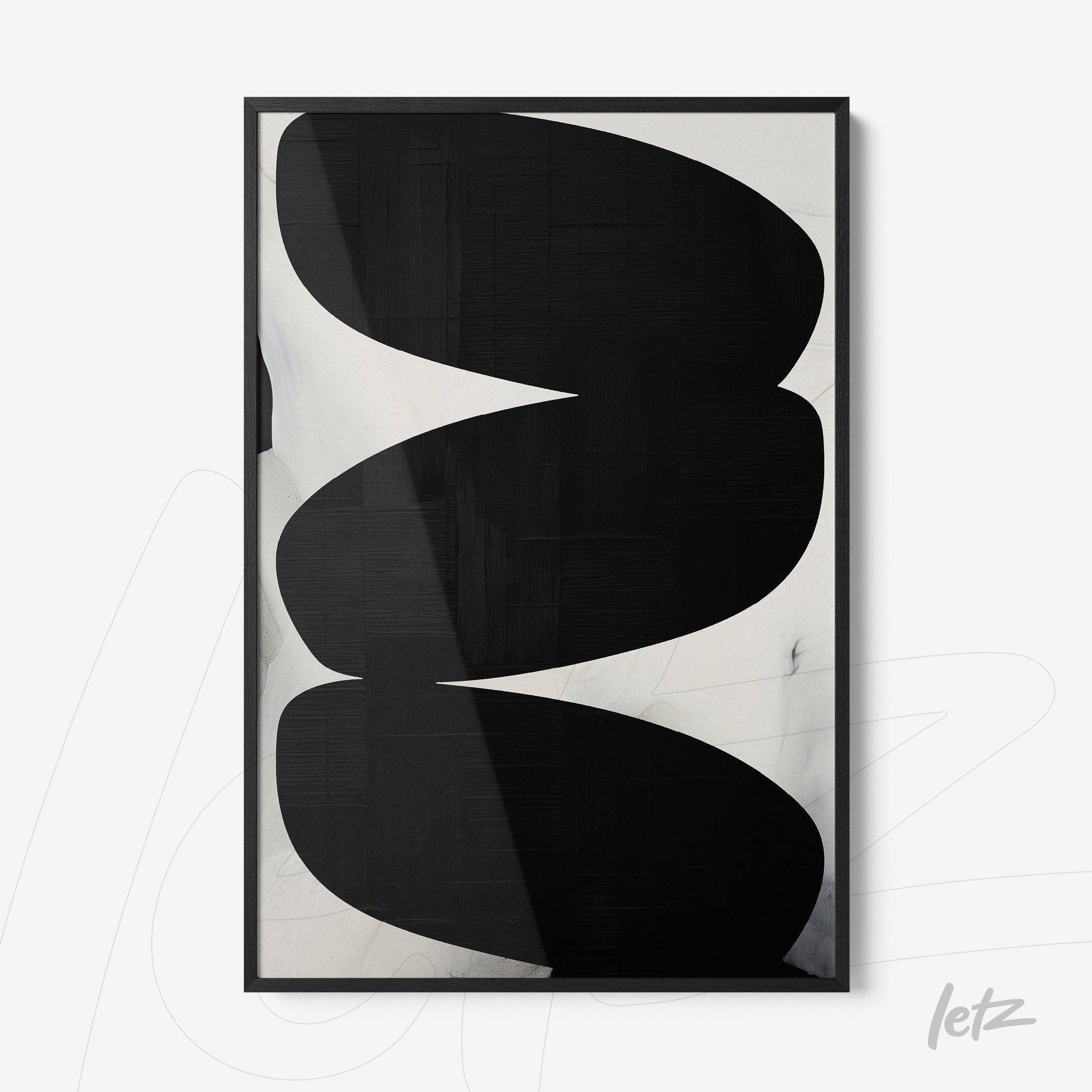 framed artwork with abstract black and white design in sleek black frame