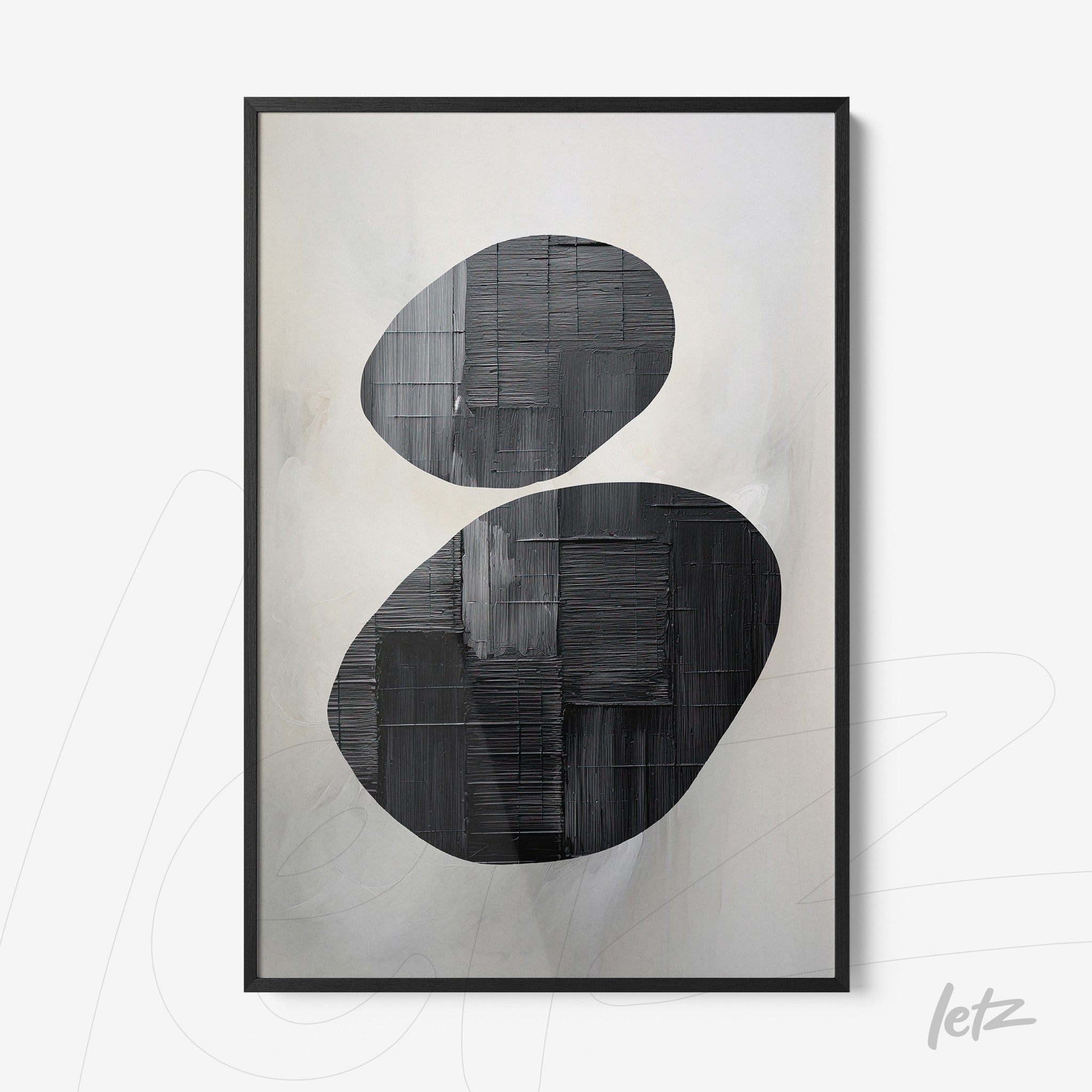 abstract wall art in black and white featuring oval shapes on a light background with a black frame